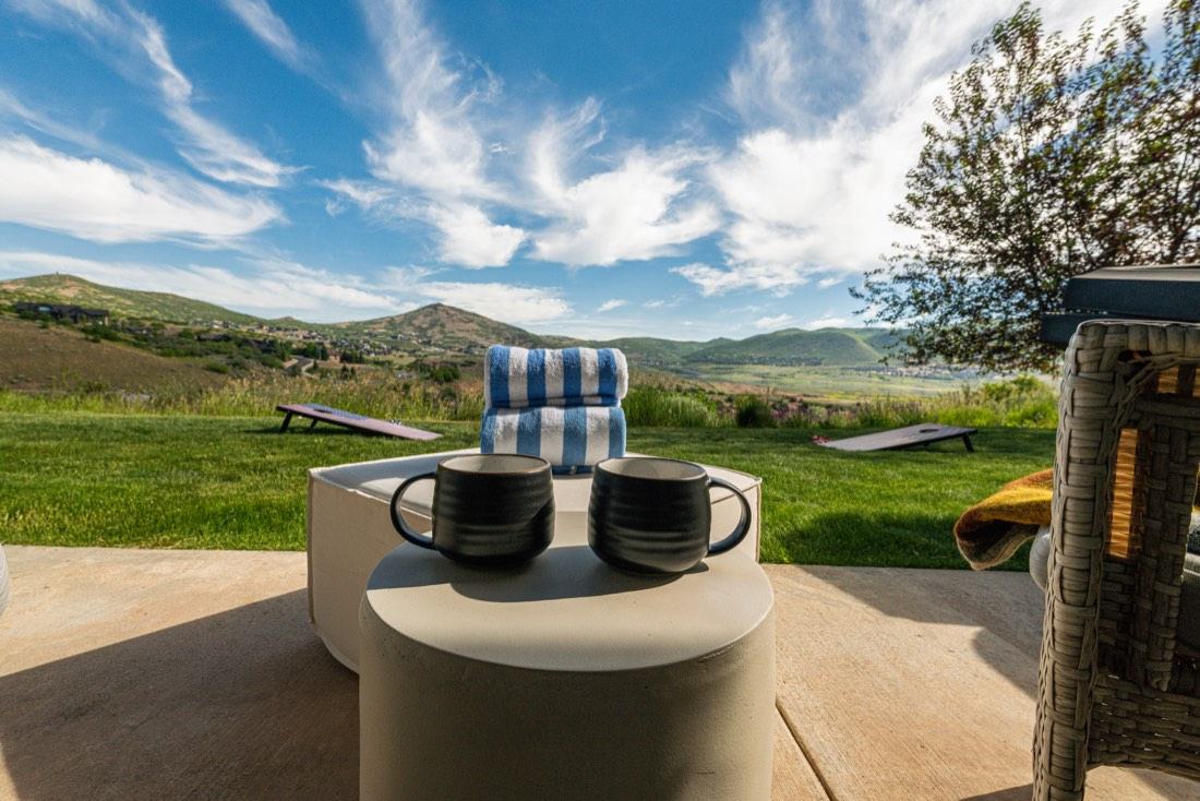 Outdoor dining deck at Mayflower Vista overlooking Heber Valley and Deer Valley mountains
