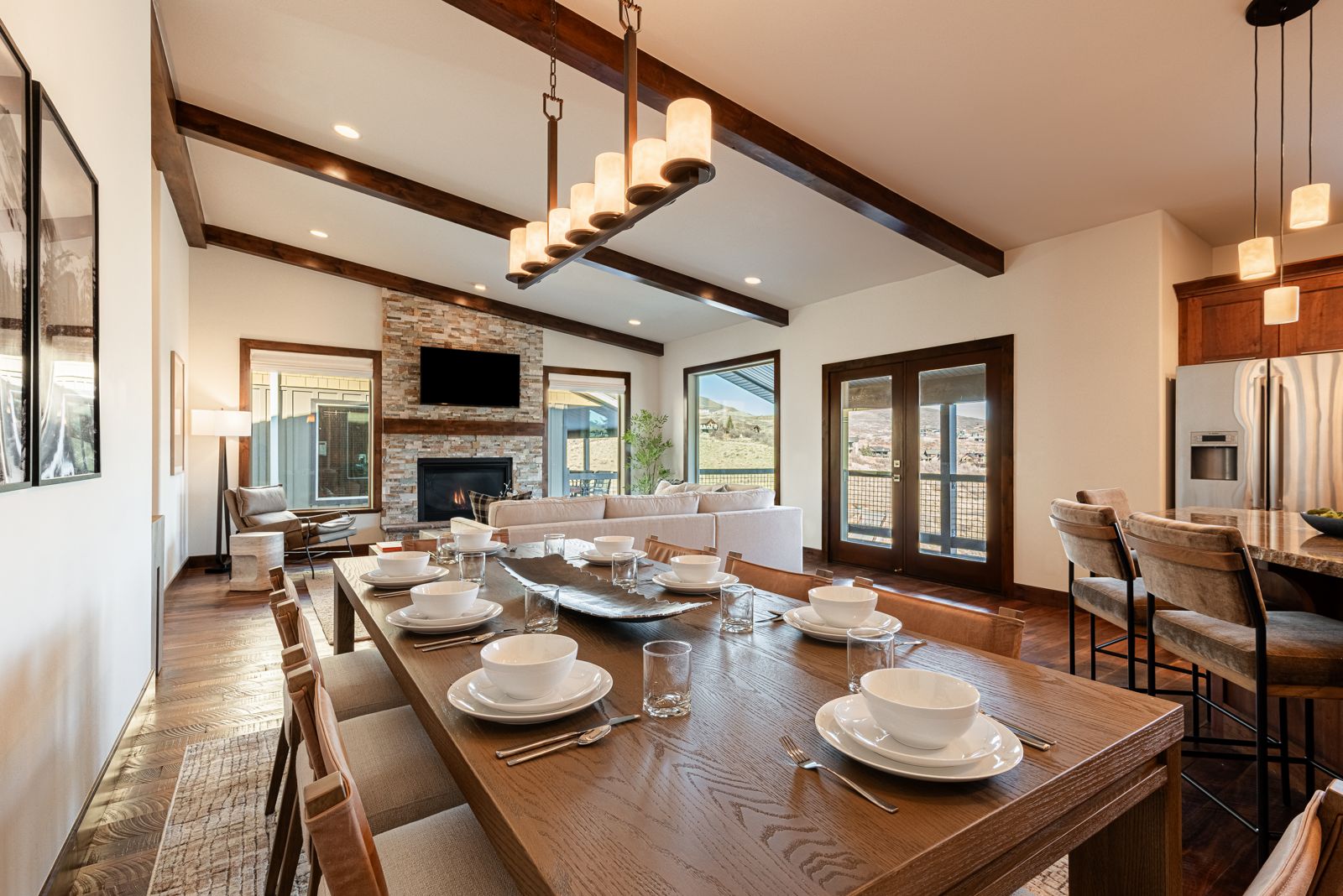 Spacious living and dining area with high ceilings, scenic views, and spacious seating